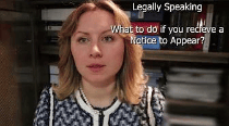 A woman with shoulder-length blonde hair is sitting in front of a shelf filled with documents. Text overlay reads 'Legally Speaking: What to do if you receive a Notice to Appear?'