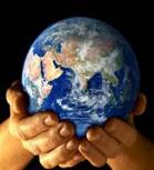 Two hands gently holding a detailed globe, representing Earth, against a dark background.